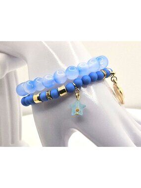 Blue Beaded Stretch Bracelet Stack With Gold Tone Accents And Star Charms